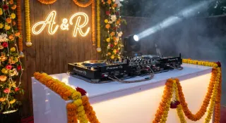 set the whole booth up around their first-dance song. those initials in lights got me a little emotional ngl ✨
