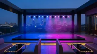 the rooftop set before guests came up. blue and magenta on the skyline is just *chef's kiss*. tonight's gonna be good